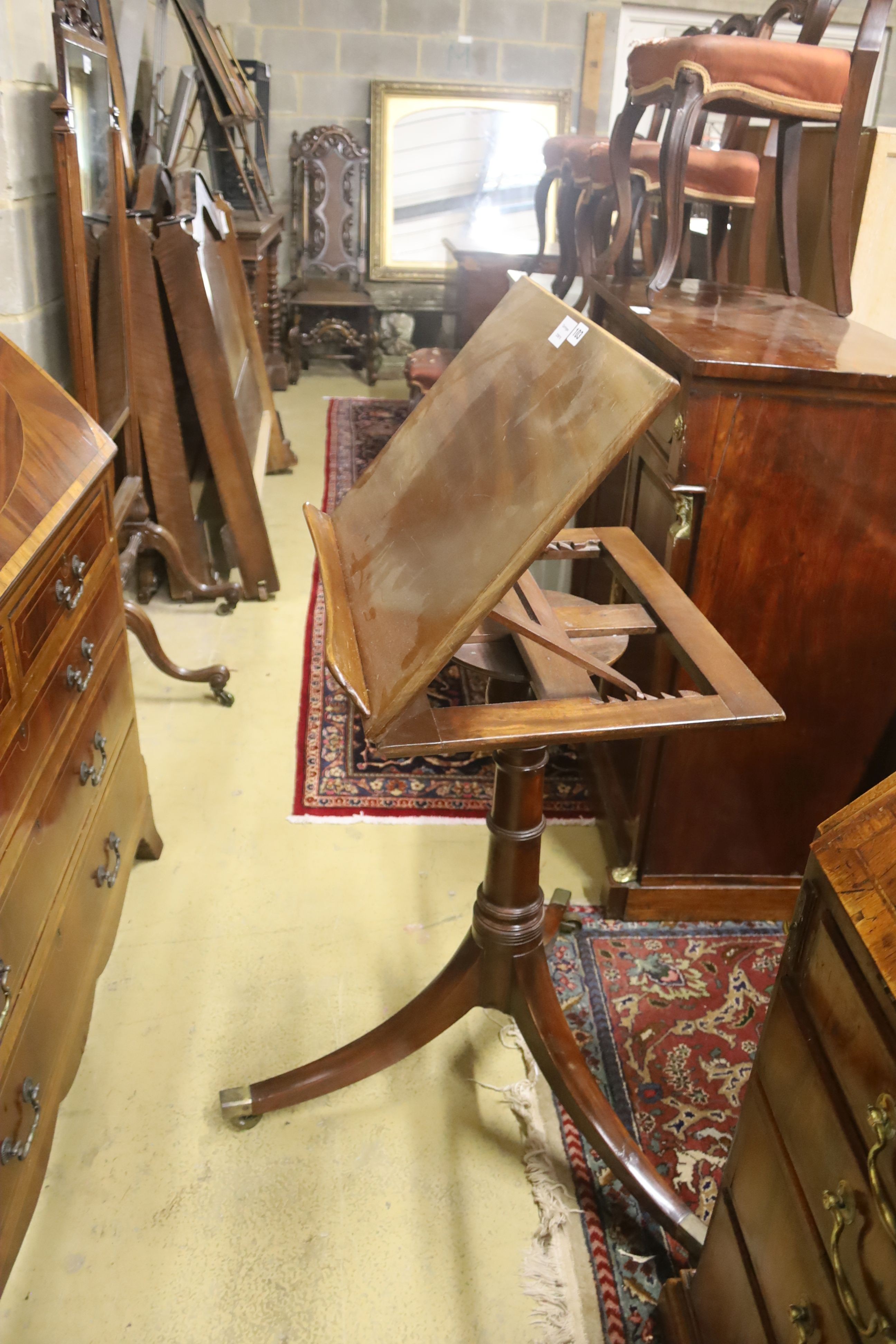 A George III style mahogany adjustable music stand, width 53cm, height 110cm